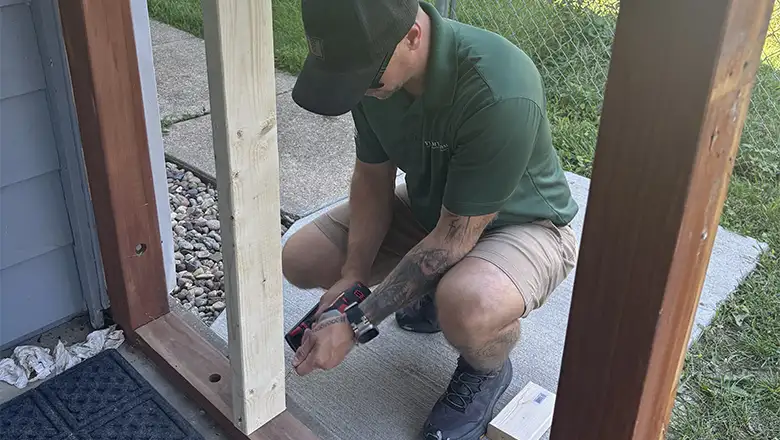Our Handyman fixing a fence for a client in Omaha