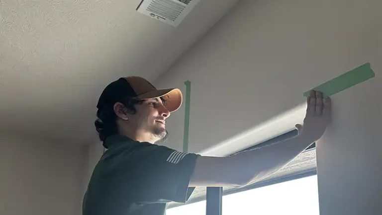 Drywall repair in progress with professional tools, seamless finish that blends into the wall