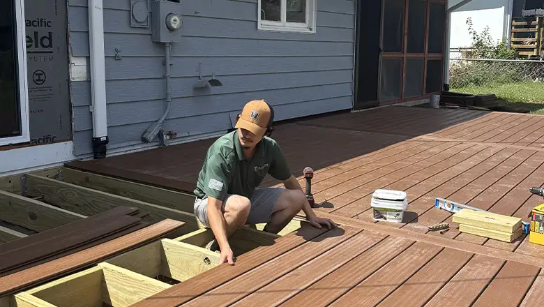move out handyman Omaha installing decking boards on outdoor deck