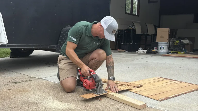 Villa My Home handyman in Omaha cutting wood with a power saw during carpentry repair and deck work.