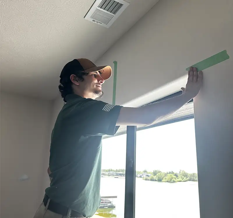 Villa My Home handyman services Omaha NE preparing wall and trim for professional finishing