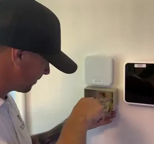 Technician mounting a new light switch in Council Bluffs. Commercial handyman Omaha businesses trust. Villa My Home provides fast repairs, maintenance plans, and tenant improvements for offices and retail spaces.