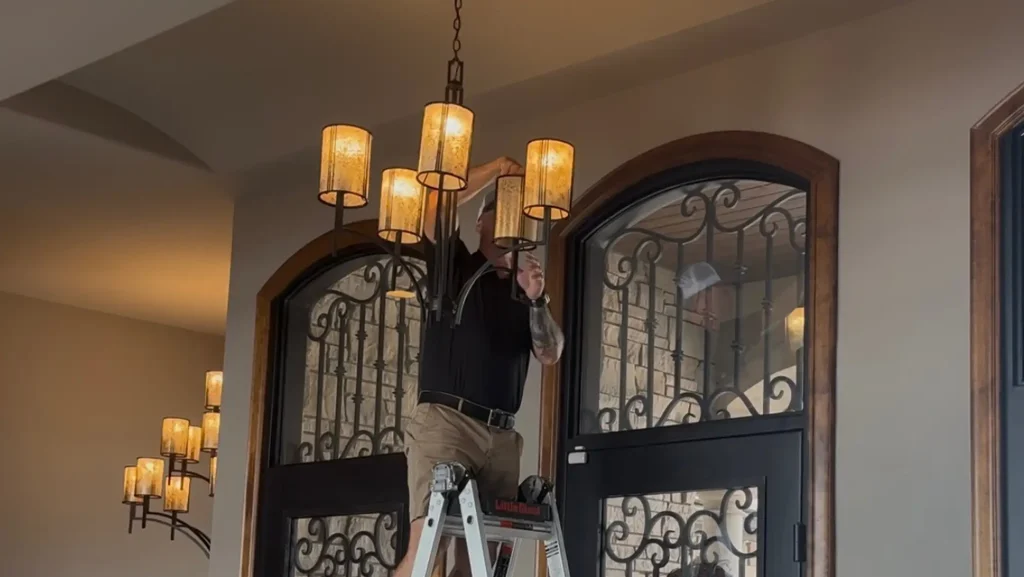 Handyman for seniors Omaha installing light fixture in home for aging in place safety upgrade